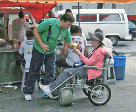 disabled travel wheelchair nancy nate brazil rio marcelo gives drink
